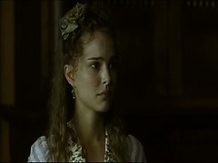 Natalie Portman lying naked on her side on some hay on the